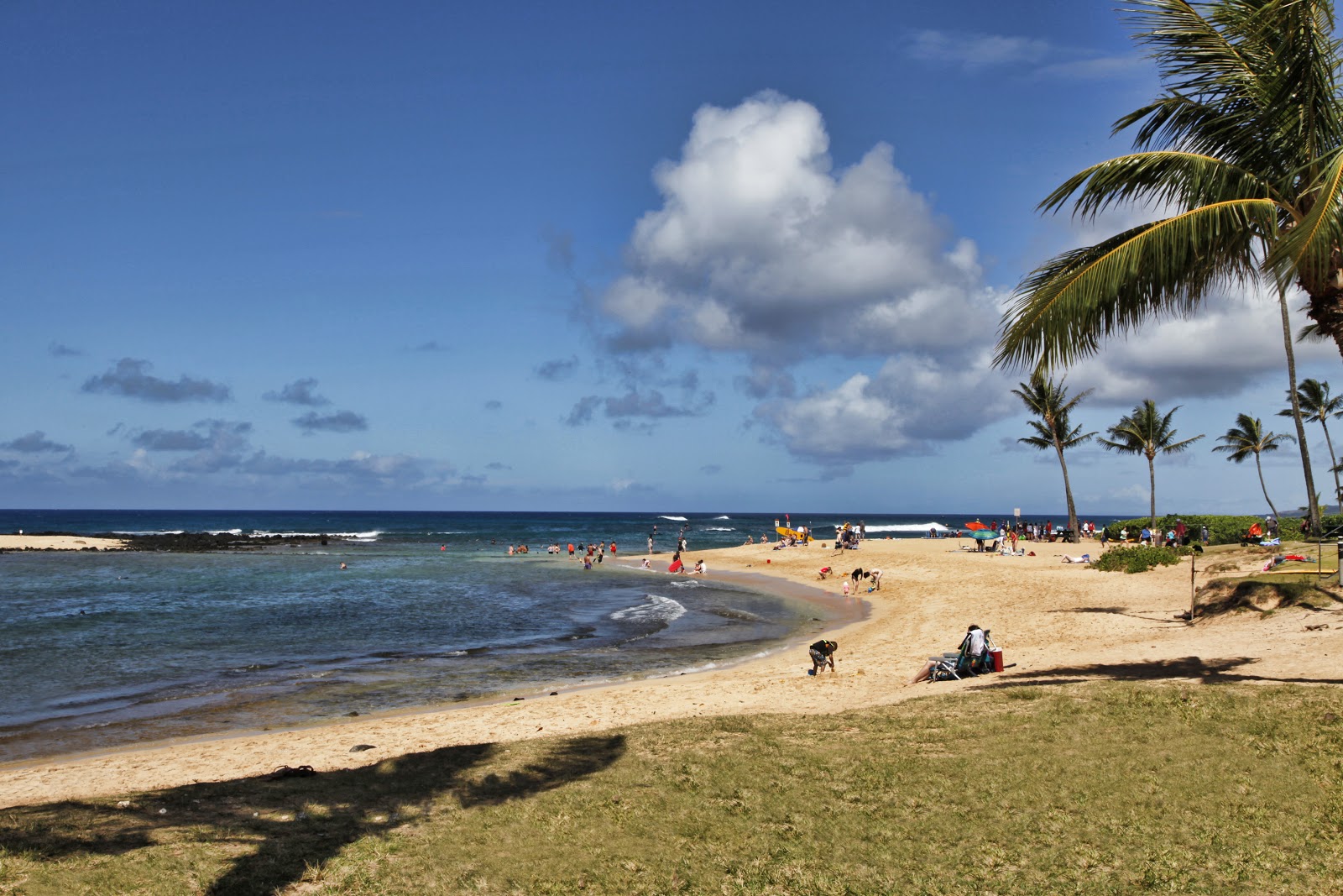 a sunny day on the sandy poipu beach in kauai