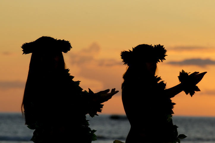 Girls dance the Hula during sunset Girls dance the Hula during sunset