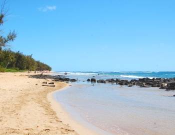 shallow waters in front of rocks at gillin's beach